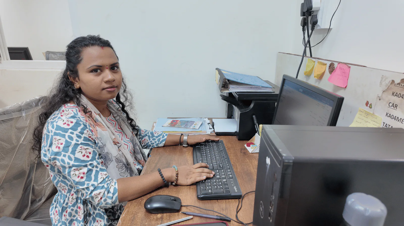 MV Technologies office team member working at her computer