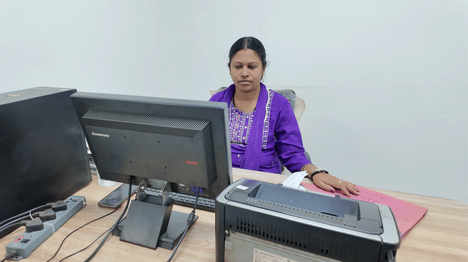 MV Technologies office team member at her workstation