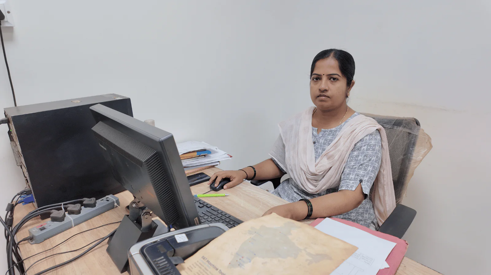 MV Technologies office team member working at her desk
