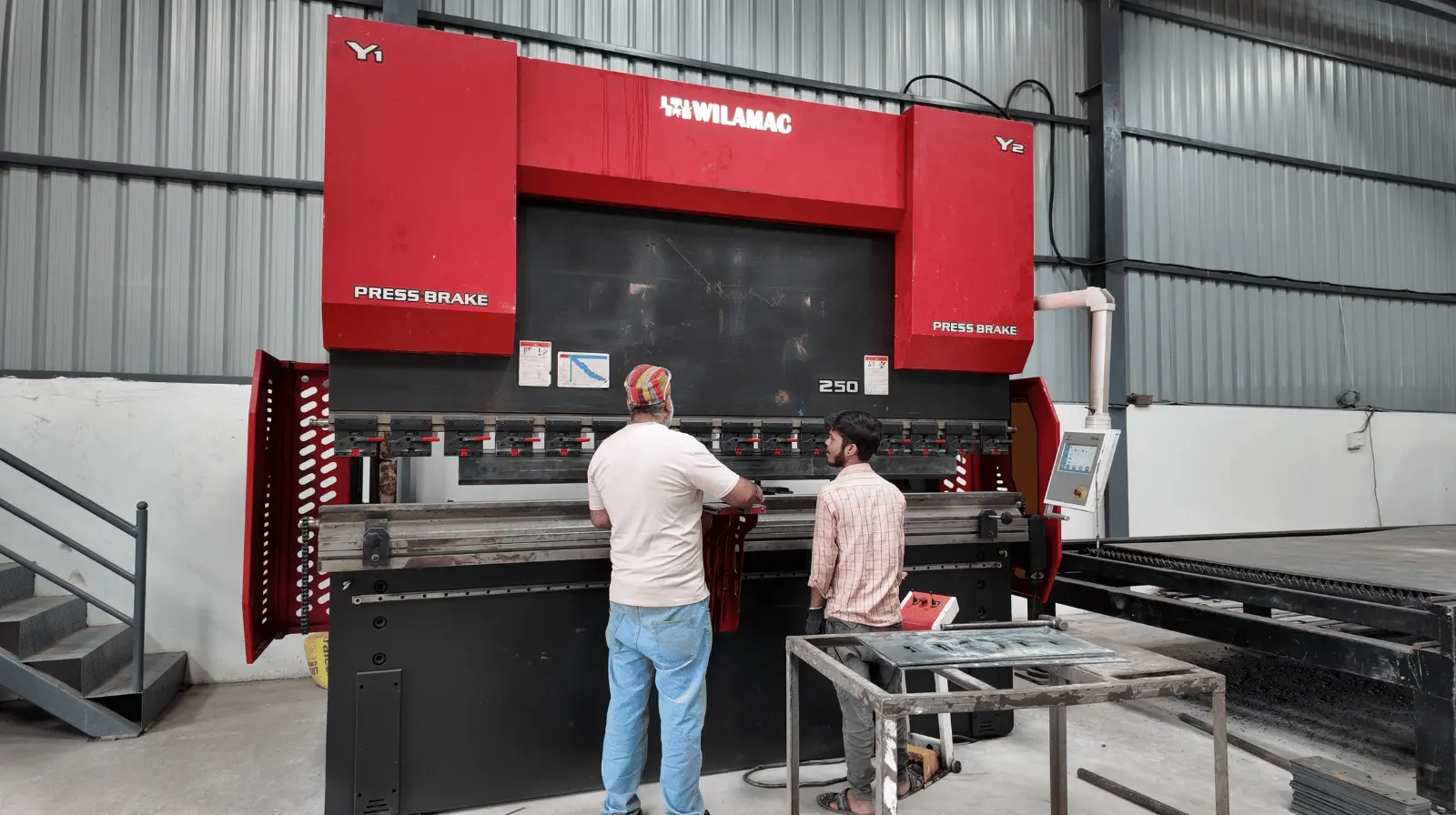 CNC press brake bending a sheet-metal component