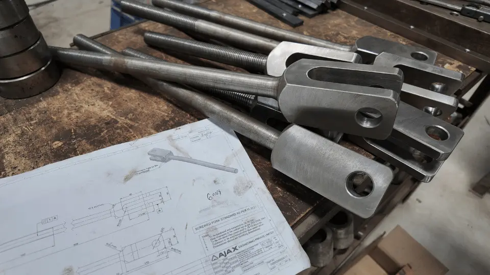 Machined fork-end rod assemblies