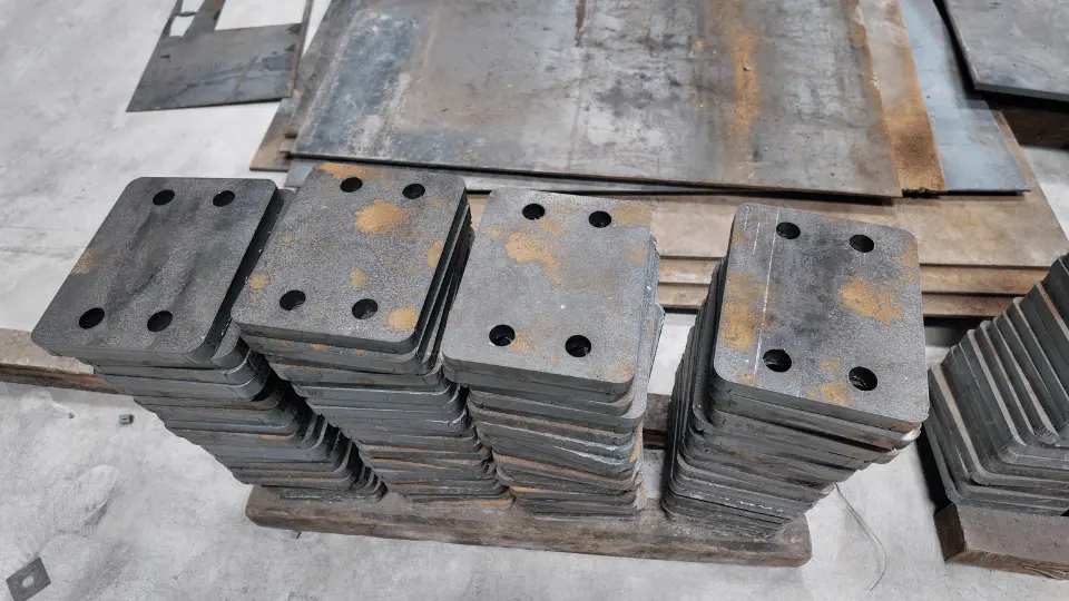 Stacked drilled steel mounting plates