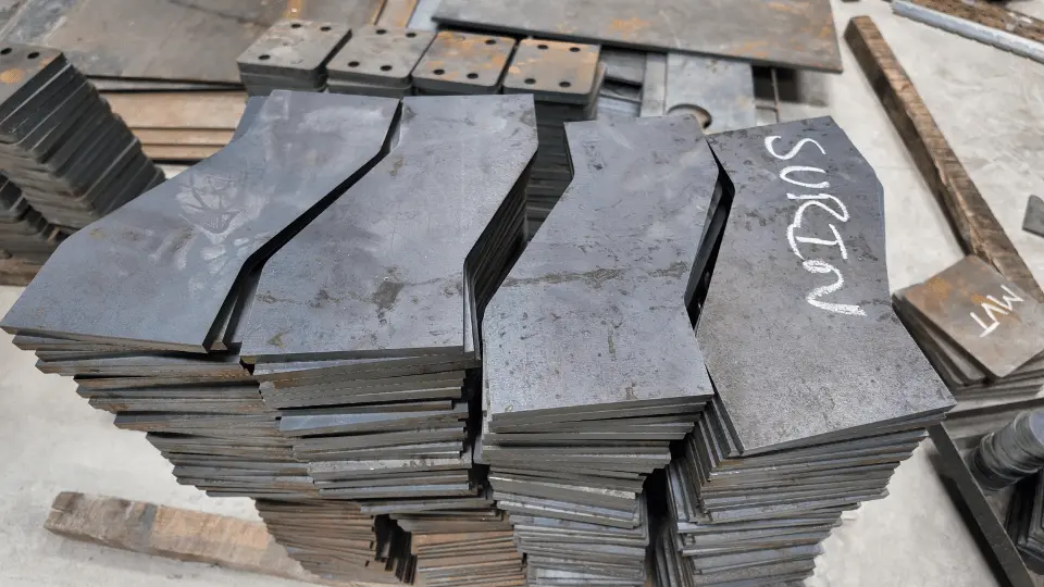 Stacks of shaped steel blanks