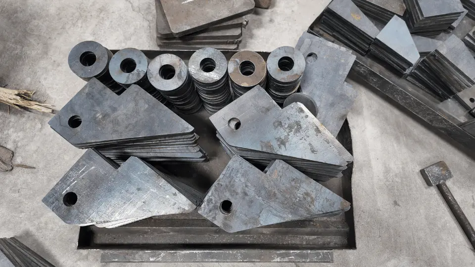 Triangular steel plates and machined rings